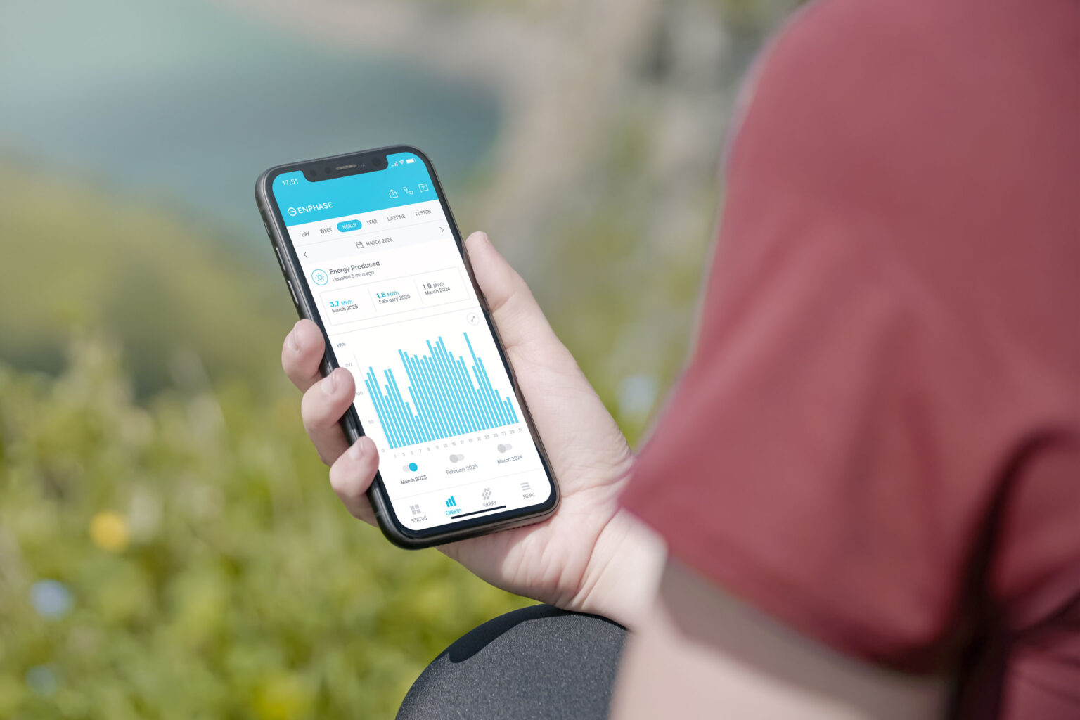 Homeowner reviewing solar production data on a phone