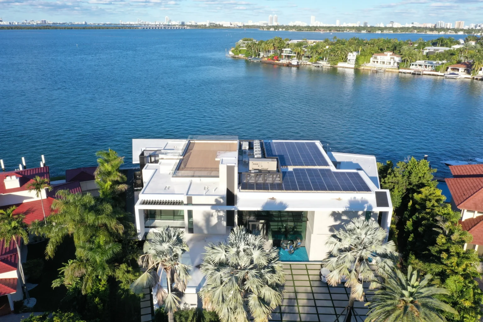 Waterfront Florida home with rooftop solar panels