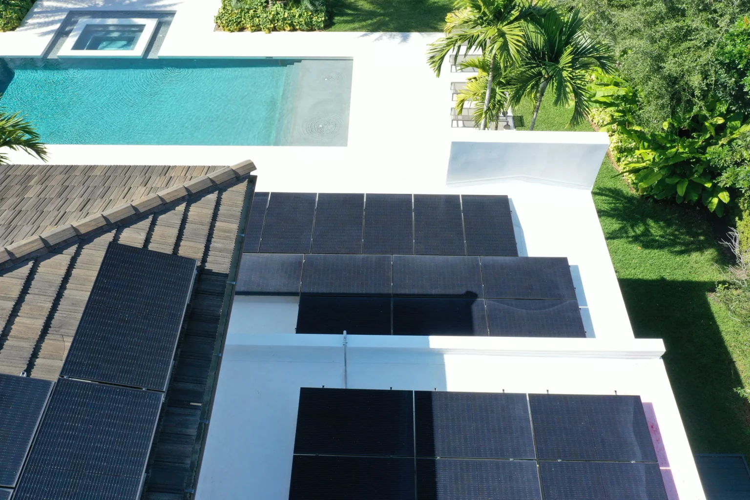 Close-up of solar panels along a Florida tile roofline