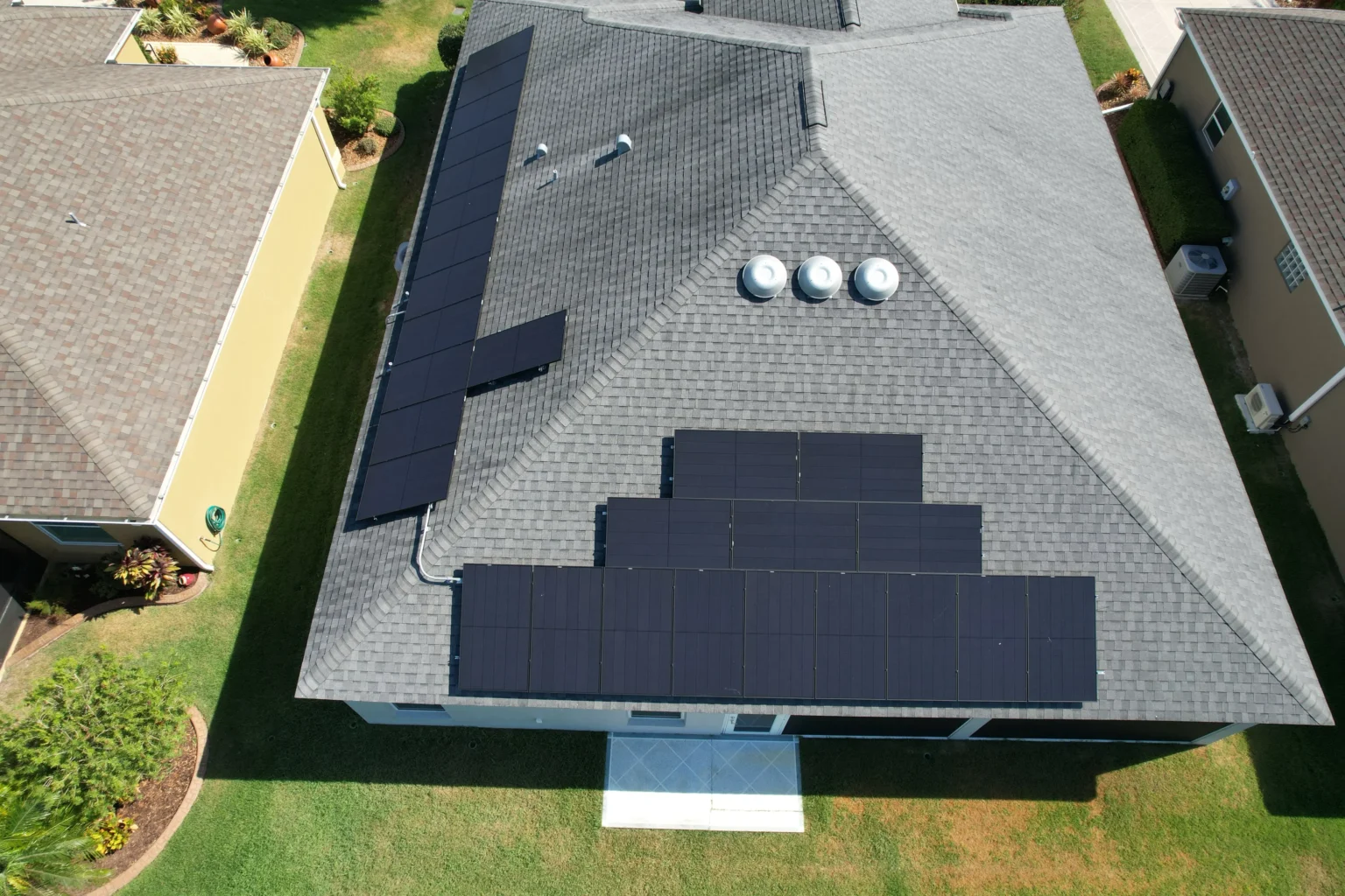 Florida home with a shingle roof and rooftop solar panels