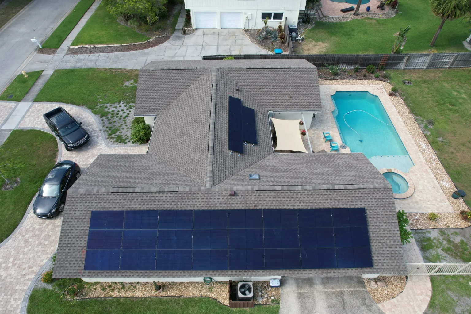 Aerial view of a Florida home with a permitted rooftop solar system