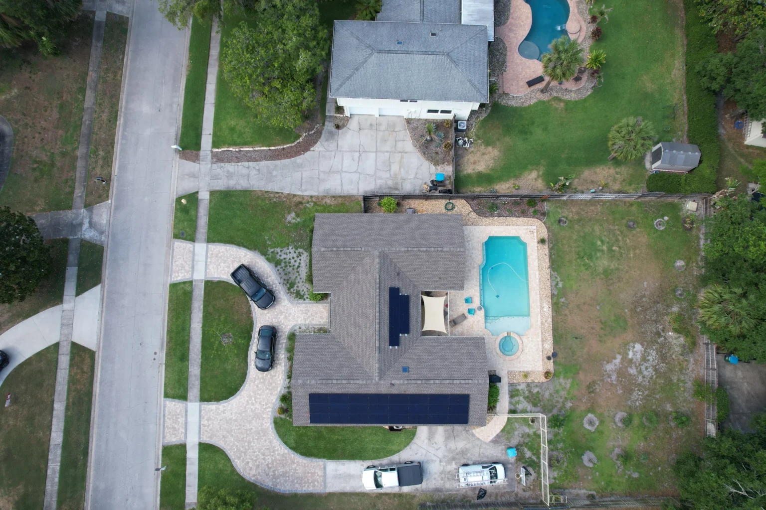 Aerial view of a Florida neighborhood home with rooftop solar panels