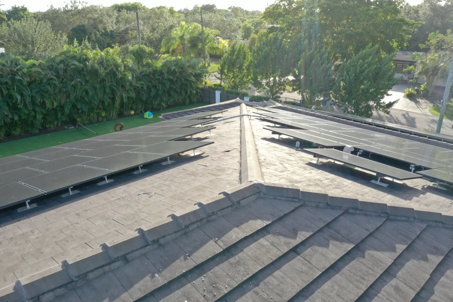 Close-up of solar panels mounted on a Florida tile roof