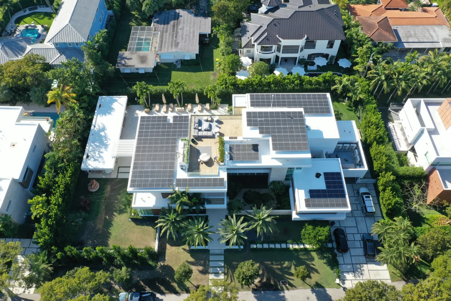 Aerial view of a modern Florida home with rooftop solar panels