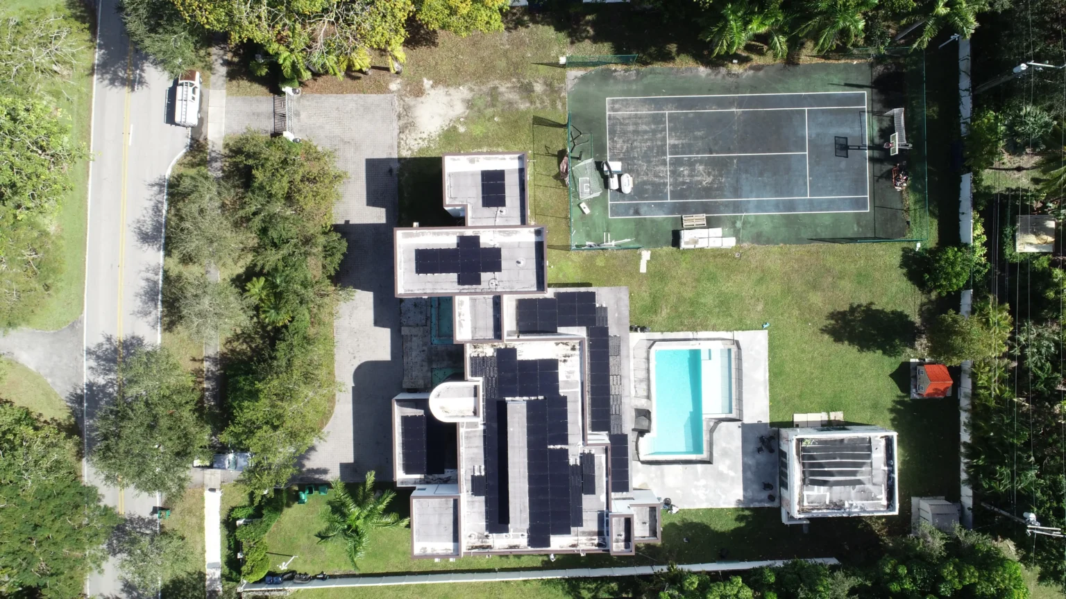 Aerial view of a Florida home with solar panels after hurricane season